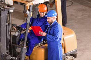 Workers reading the Hogan Safety Assessment