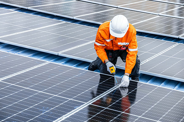 Man fitting solar panels - skills that an be acquired at Nottingham College new green skills centre.