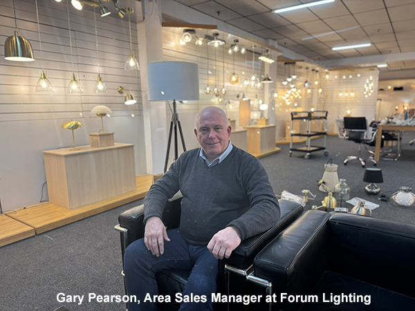 Gary Pearson, New Area Sales Manager at Forum Lighting, instrumental in company growth, and is seated in a lighting showroom on a back leather armchair