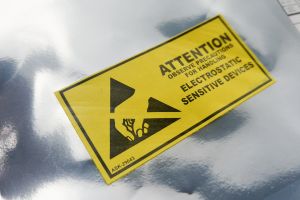 Electronic appliance label at risk of being compromised by outgassing.