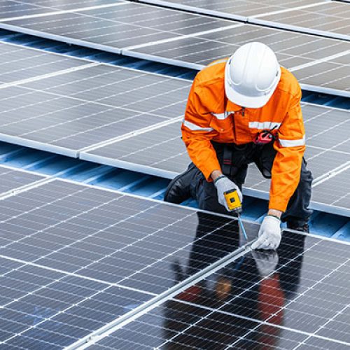 Man fitting solar panels - skills that an be acquired at Nottingham College new green skills centre.