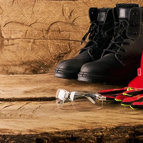 Safety boots with safety helmet and gloves
